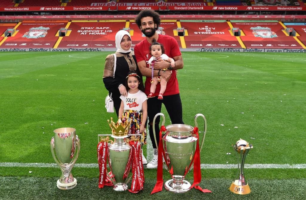 Mohamed Salah introduces his family to the Premier League trophy after Liverpool triumph