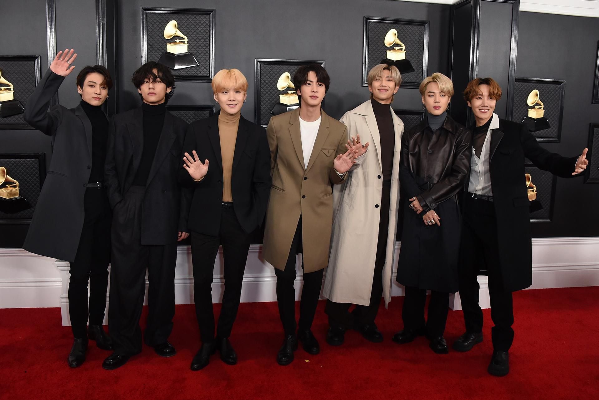 BTS turn airport into fashion show ahead of 64th Grammy Awards at