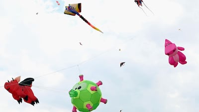 Kites fly over Marina Barrage in Singapore. AFP