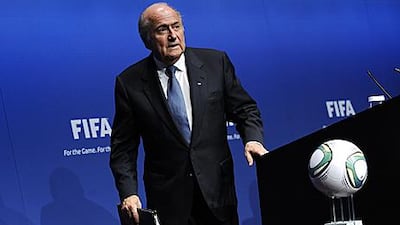 Sepp Blatter leaves the podium after announcing in Zurich that there is nothing wrong with the process of Qatar's World Cup 2022 bid.