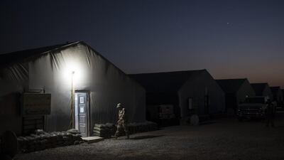 An Iraqi army soldier walks to a tent at the Qayara air base, south of Mosul. Felipe Dana / AP Photo