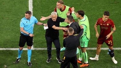 Roma manager Jose Mourinho confronts fourth official Michael Oliver after referee Anthony Taylor awarded a penalty to Sevilla that was later overturned following a VAR check. Getty