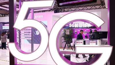 A 5G logo hangs from a pavilion at the 2019 World 5G Convention in Beijing, China. EPA
