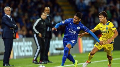 Riyad Mahrez, left, of Leicester City in action against FC Porto’s Oliver Torres. Tim Keeton / EPA