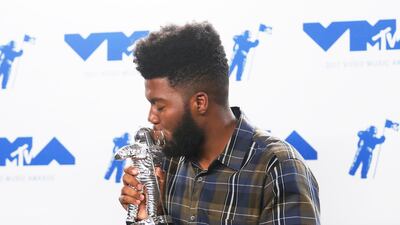 Khalid poses with the Best New Artist award. Danny Moloshok / Reuters