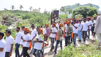 GC- Villagers plant trees to celebrate birth of girl child in Piplantri village in the desert state of Rajasthan. Shyam Sunder Paliwal (moustached man in white clothes and turban) seen with villagers as they celebrate 'Raksha Bandhan' by tying rakhi to plants. Picture credit- Prem Shankar
