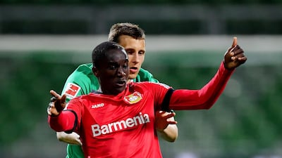 Bayer Leverkusen's Moussa Diaby in action with Werder Bremen's Maximilian Eggestein, as play resumes behind closed doors following the outbreak of the coronavirus disease. Reuters