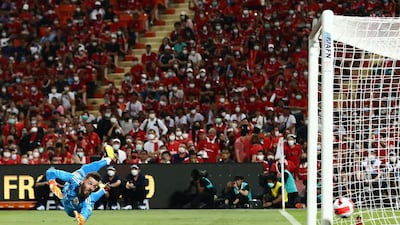 Manchester United goalkeeper David de Gea dives to try to save a shot. AFP