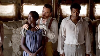 Lupita Nyong’o, left, Michael Fassbender and Chiwetel Ejiofor in a scene from 12 Years A Slave. Francois Duhamel / courtesy Fox Searchlight /AP