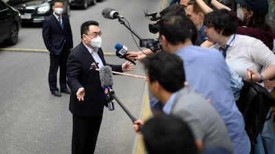 Qun Wang addresses the media in Vienna. EPA