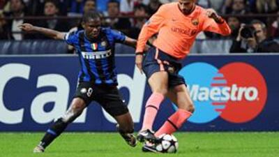 Inter Milan's Cameroon forward Samuel Eto'o, left, fights for the ball with his former teammate, Barcelona's Gerard Pique, at the San Siro.
