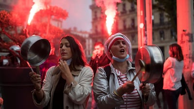 Restaurant owners clang spoons and dishes at a demonstration against restaurant closures in Marseille, southern France. AP Photo