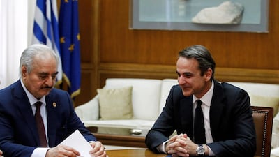 Greek Prime Minister Mitsotakis talks with Commander of the Libyan National Army Khalifa Haftar during their meeting in Parliament, in Athens, Greece in January 2020. EPA