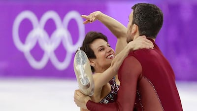 Bronze medalists Meagan Duhamel and Eric Radford of Canada react compete during of the Pair Free Skating in the Figure Skating competition at the Gangneung Ice Arena. How Hwee Young / EPA