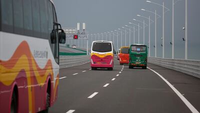 Buses drive on the Hong Kong-Zhuhai-Macau Bridge. Reuters