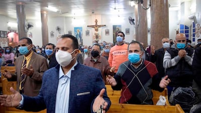 Egyptian Christians worshippers attend Christmas Eve mass at the Coptic Catholic St. Mark Church in Minya city. AFP