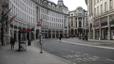 Pedestrians walk along a sparsely populated Regents Street in London, UK, on March 20, 2020 after a shutdown of the British capital. Bloomberg