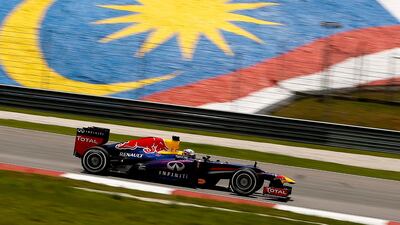Sebastian Vettel took pole position in the qualifying session for the Malaysian Grand Prix.