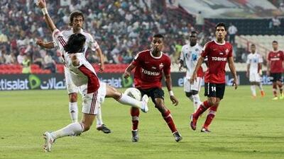 Al Jazira, in white, capitalised on Al Ahli’s errors last night to kick-start their Pro League title defence in emphatic fashion.