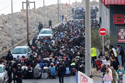 Police prepare to move migrants to a new camp in Ceuta. EPA
