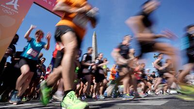 People run as they take part in the "Journee Olympique" ("Olympic day") in Paris. AFP