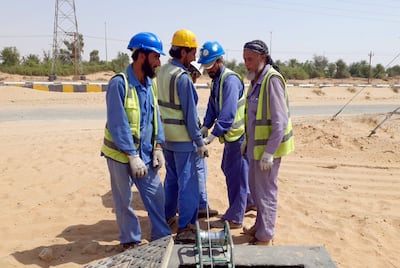 Colleagues said Ismail Khan (extreme right) took pride in his job readying areas to place electricity cables in the capital. Photo: Ismail Khan family