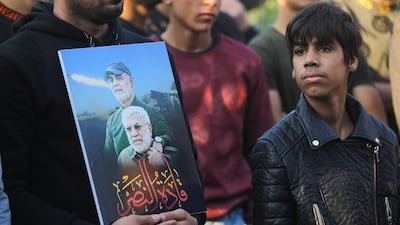 Iraqi supporters of the Hashed al-Shaabi paramilitary carry portraits of Iraqi commander Abu Mahdi al-Muhandis and Iranian Revolutionary Guards commander Qasem Soleimani during a demonstration in Baghdad's western Shoala neighbourhood. AFP
