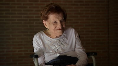 Holocaust survivor Lola Mandelkier Sztrum, 101, in a nursing home in Buenos Aires. In the world of care giving, while AI might excel at processing medical data or monitoring vital signs, the human elements of such work – empathy, cultural understanding, and physical assistance – will remain crucial and thus still need people. AFP