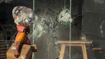 Glass is broken at a KFC restaurant at Naledi shopping complex in Vosloorus, east of Johannesburg.