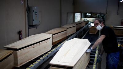An employee works on a coffin at the manufacturing plant OGF in Jussey as the spread of the coronavirus disease continues in France. Reuters