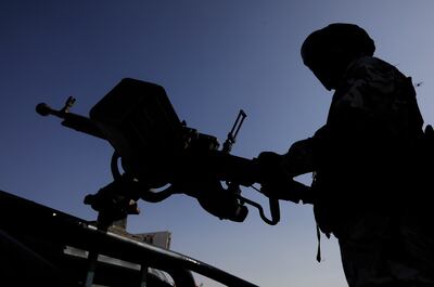 A Houthi soldier mans a machine gun on a vehicle while on patrol. EPA