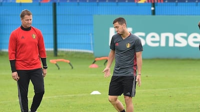 Belgium forward Eden Hazard (R) reacts as he takes part in a training session during the Euro 2016 football tournament at Le Haillan on June 30, 2016. Nicolas Tucat / AFP