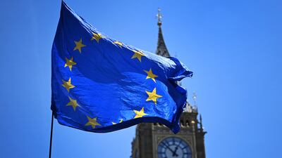 An EU flag flies outside Parliament in London where legislators plan to scrap parts of the post-Brexit trade deal between the UK and Europe. EPA.