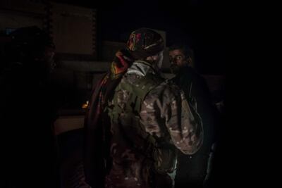 YPG commander Giager Amed directs vehicles towards the frontline in Baghouz, where his men are battling ISIS, Deir Ezzour, Syria. Campbell MacDiarmid / The National