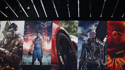 A collage of PS4 games are displayed during the Sony press conference at E3. Dan Krauss / Getty Images / AFP