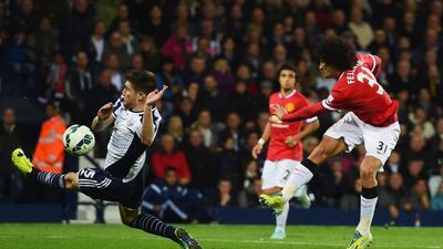 Marouane Fellaini of Manchester United shoots past Sebastien Pocognoli of West Bromwich Albion to score their first goal and make it 1-1 in the eventual 2-2 draw on Monday night at The Hawthorns. Michael Regan / Getty Images