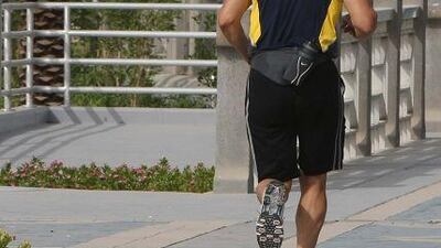 A jogger on the Corniche in Abu Dhabi. Readers offer differing opinions on the worth of fitness programmes and the licensing of trainers.