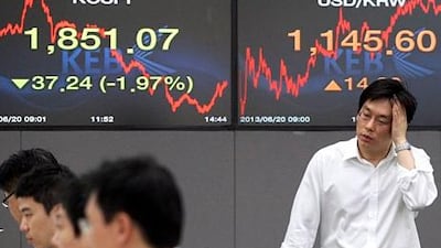 Asian stock markets fell Thursday after the US Federal Reserve said it could start scaling back its huge economic stimulus programme later this year. Ahn Young-joon / AP Photo