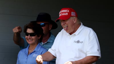 Mr Trump looks on from the 18th green during day two of the LIV Golf Invitational - DC. AFP