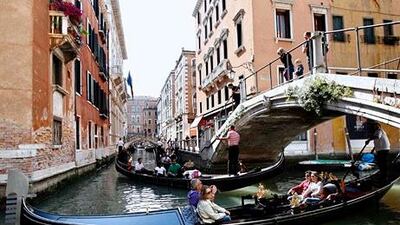 The number of visitors from the UAE to Italy is on the rise. Above, tourists enjoy rides on gondolas in Venice. Stefano Rellandini / Reuters