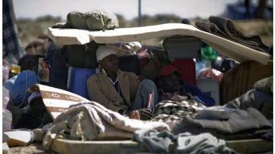 Ghanaians who fled Libya rest at the Choucha transit camp. The UK department is assisting refugees who had fled to neighbouring countries.