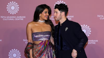 Priyanka Chopra in a dress by Amit Aggarwal with her husband Nick Jonas at the opening of the Nita Mukesh Ambani Cultural Centre in Mumbai. Reuters
