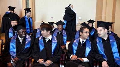 Abu Dhabi, United Arab Emirates, June 11, 2013: Masdar's class of 2013 master's graduates socialize and prepare as they wait to take the stage to receive their diplomas at their graduation ceremony on Wednesday evening, June 12, 2013 at the Emirates Palace in Abu Dhabi. Silvia Razgova / The National *** Local Caption *** sr-130612-masdargrad02.jpg