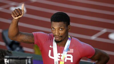 Fred Kerley celebrates on the podium after winning gold in the men’s 100m final. Getty