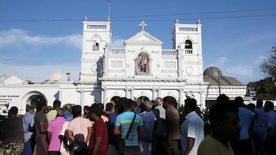 Locals stand in front of St Anthony's shrine in Colombo, after bomb blasts ripped through churches and luxury hotels on Easter, in Sri Lanka. Reuters