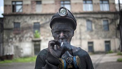 A Ukrainian miner at the Kalinin mine in eastern Ukraine city of Horlivka. In the first quarter, Ukraine produced 5.99 million metric tonnes of coking coal, which is used in steel making, down 4.2 per cent from 6.25 million metric tonnes during the same period of 2013. Evgeniy Maloletka / AP Photo