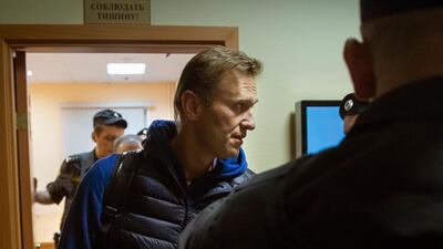 Alexei Navalny is escorted from a court room after a session in Moscow. AP