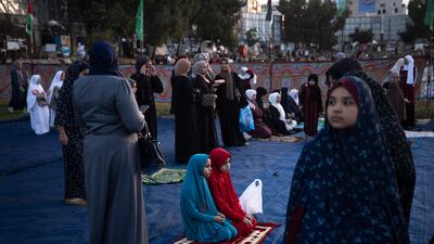Palestinians attend morning prayers on the first day of Eid in Gaza. AP