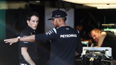 Lewis Hamilton, right, of Mercedes GP talks to a member of the team in the garage during previews to the Monaco Grand Prix at Circuit de Monaco on May 25, 2016 in Monte-Carlo, Monaco. Lars Baron/Getty Images