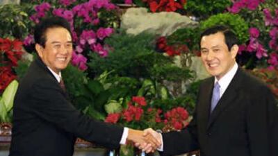 The Taiwan president Ma Ying-jeou (right) and Chen Yunlin (left), Beijing's most senior negotiator on Taiwanese affairs, shake hands at the Taipei Guest House.